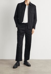 Calvin Klein Trousers - black