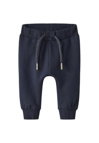 Pantalons de survêtement en mélange de coton bleu marine avec taille élastique et cordon de serrage ajustable. Comprend des poignets côtelés et une texture lisse.