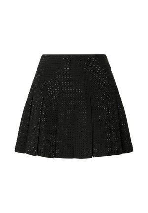 Gonna nera plissettata in tessuto traforato, caratterizzata da un design testurizzato con fori circolari uniformemente distribuiti su tutta la superficie.