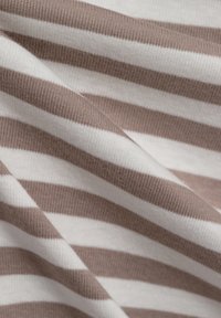 Striped fabric featuring alternating brown and white lines. Material appears soft with ribbed texture, revealing depth in folds.