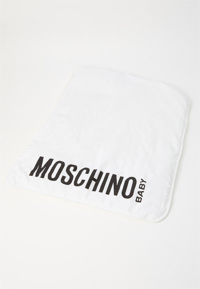 White padded blanket with a smooth texture, featuring bold black text: "MOSCHINO BABY" on one edge. Soft, lightweight material.