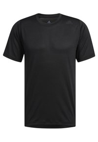 Camiseta deportiva negra de manga corta hecha de tejido ligero. Presenta un cuello redondo y un sutil patrón texturizado. Logo en la parte superior izquierda.