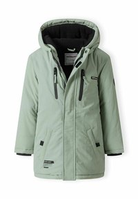 Manteau d'hiver vert clair à capuche avec poches zippées noires, doublure intérieure noire et fermeture à rabat frontal avec bouton-pression.