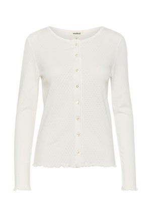 Cardigan bianco con maniche lunghe realizzato in tessuto morbido. Presenta un collo arrotondato, chiusura con bottoni, un piccolo motivo testurizzato e un orlo arricciato.