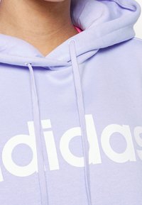 adidas Performance Jersey con capucha - purple