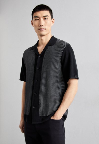 Short-sleeve shirt with a black and gray striped design, featuring a buttoned front and open collar, textured knit material.