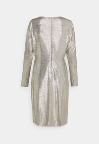 Silver metallic dress with long sleeves, a slightly curved neckline, and a hidden back zipper. Textured fabric with a sleek, fitted silhouette.