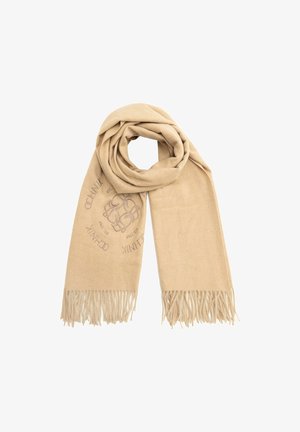 Beżowy szalik wykonany z miękkiego materiału, z tkaną strukturą i frędzlami na krawędziach. Ozdobny wzór w układzie okrągłym.