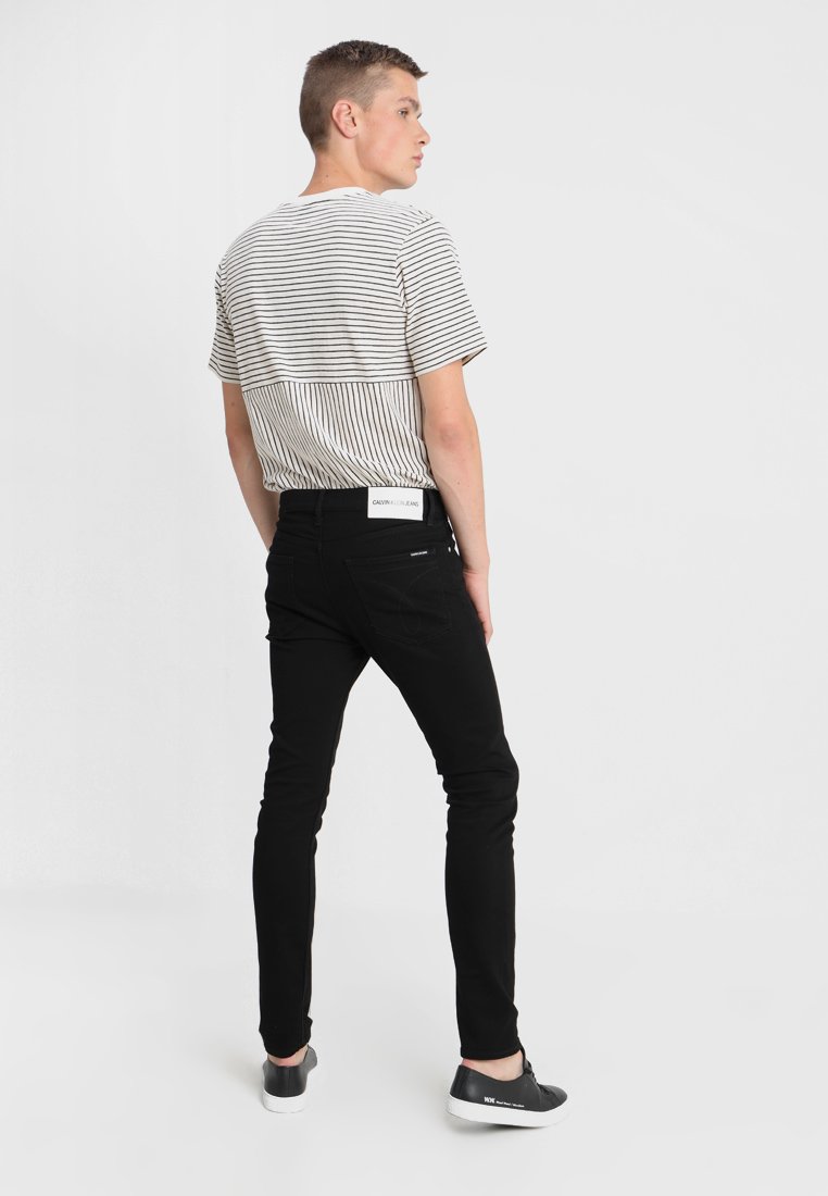 Calvin Klein Jeans 016 SKINNY - Aptempti džinsai - stay black/juoda -  Zalando.lt