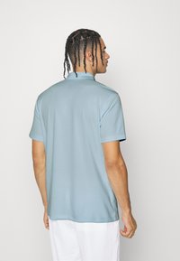 Nike Performance SOLID - Polo - glacier blue/white