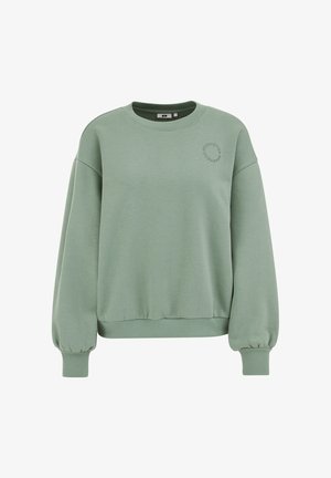 Zelena jopa iz mehke mešanice bombaža z okrolim izrezom, ohlapnega kroja ter širokimi manšetami in spodnjim robom z rebrastim vzorcem. Prisoten je subtilen vezen detajl.