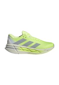 Scarpa sportiva verde lime con tomaia in rete traspirante, design a tre strisce argento e suola texturizzata per aderenza e stabilità.