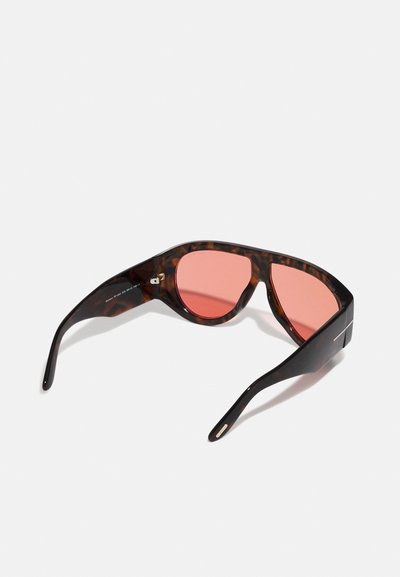 Tortoiseshell sunglasses with pink-tinted lenses. Angular design, smooth texture, and black accents on the arms. Lightweight construction.