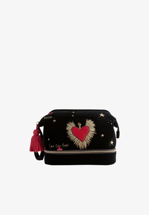 Black velvet cosmetic bag featuring red heart and gold embroidered accents, with a tassel zipper pull and decorative star patterns.