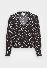Blusa preta de mangas longas com padrão floral em branco e laranja, grande colarinho, frente com botões e punhos franzidos. Tecido leve.