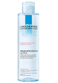 Micellar cleansing fluid in a transparent bottle, 400 ml, with a light blue label, featuring black text and decorative blue graphics.