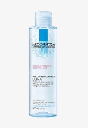Micellar cleansing fluid in a transparent bottle, 400 ml, with a light blue label, featuring black text and decorative blue graphics.