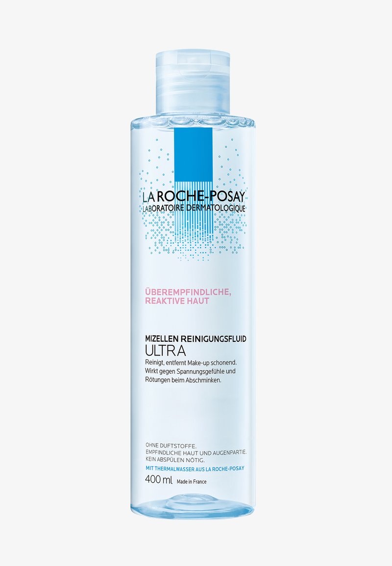 Micellar cleansing fluid in a transparent bottle, 400 ml, with a light blue label, featuring black text and decorative blue graphics.