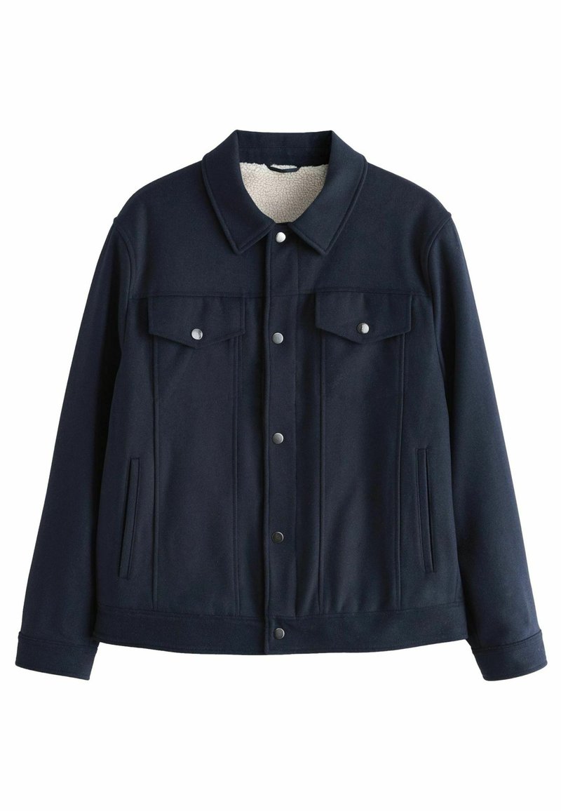 Navy blue jacket made of soft material, featuring a sherpa-lined collar, two chest pockets, silver snap buttons, and side pockets.