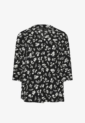 Blouse noire avec un motif floral blanc, coupe décontractée, manches trois quarts et décolleté en V. Tissu doux avec une texture lisse.