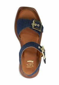 Brown sole sandal with dark blue fabric straps featuring gold-tone buckles, photographed from above on a white background.
