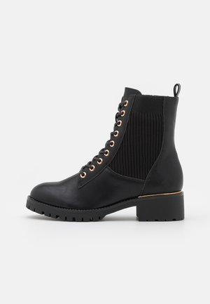 Lace-up ankle boots - black