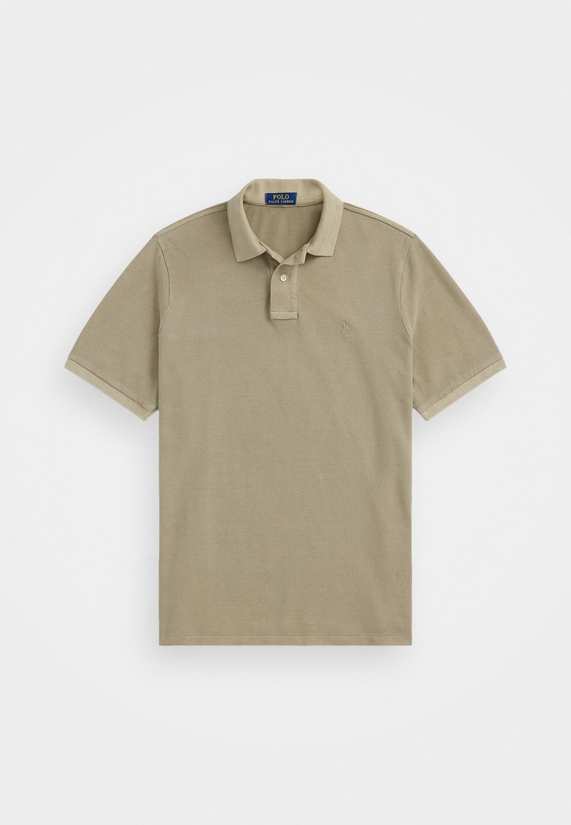 Beige polo skjorte laget av bomull, med krage, to-knapps knappestykke og korte ermer. Inkluderer en liten brodert logo.