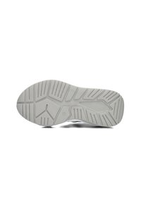 Witte rubberen schoenzool met textuurpatroon, met groeven en richels voor grip. Cirkelvormig logo ingebed vlakbij het midden.
