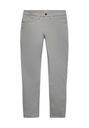 Lysegrå jeans med smal pasform med knap- og lynlåslukning foran, bæltestropper samt for- og baglommer på hvid baggrund.
