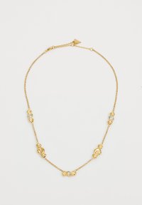 Goldkette mit abwechselnd dekorativen Gliedern und klaren Steinen. Glatte Textur mit polierter Oberfläche, Verschluss hinten.