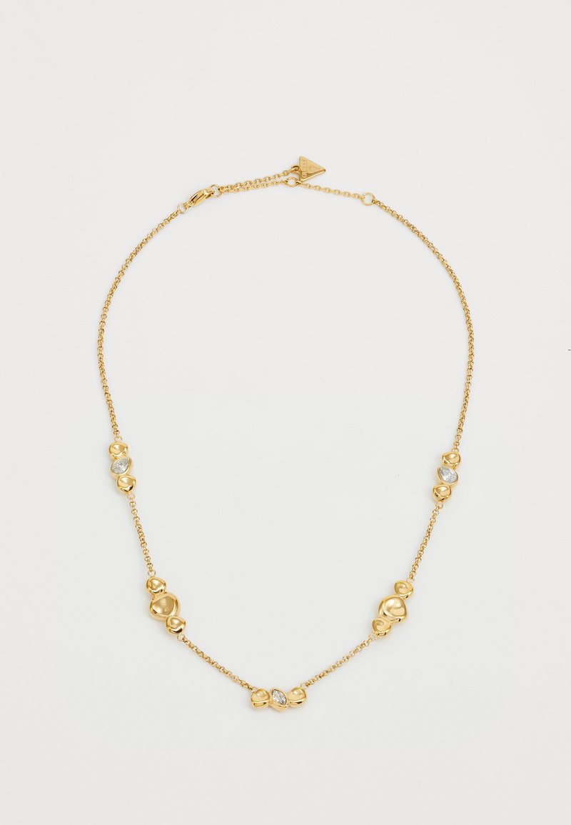 Goldkette mit abwechselnd dekorativen Gliedern und klaren Steinen. Glatte Textur mit polierter Oberfläche, Verschluss hinten.