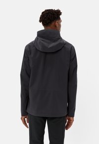 Dark gray waterproof jacket with a hood, featuring a smooth texture, minimalist design, and adjustable cuffs. Back view with no visible logos.