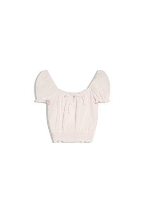 Blouse courte rose clair avec manches courtes bouffantes, encolure carrée, nœud à l'avant et ourlet élastiqué.