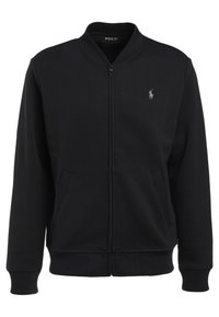 Svart zip-up sweatshirt gjord av mjukt material, med ribbad krage, muddar, två framfickor och en liten logotyp på bröstet.