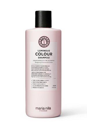 Rosa Kunststoffflasche mit dem Luminous Colour Shampoo und einer schwarzen Kappe. Das Etikett auf der Vorderseite enthält den Markennamen, Produktdetails und Anwendungshinweise.