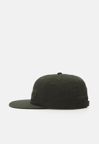 Olive green cap made of cotton, featuring a flat brim, embroidered logo on the front, and ventilating eyelets on the crown.