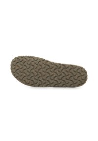 Semelle de chaussure en caoutchouc gris foncé avec un motif de vagues texturé et de petites speckles brunes. Forme courbée avec un bout et un talon arrondis.