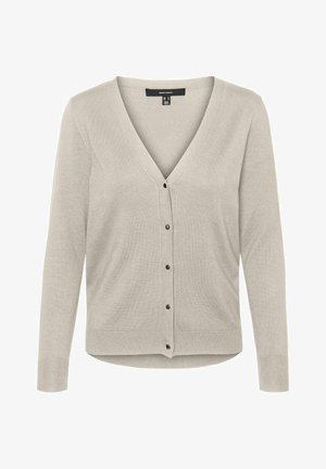 Helebeež karvab es on V-kaeluse, pika varrukaga ja viis nööpi ees. Omab soonikkoes varrukaotsasid ja sujuvat, pehme tekstuuri.