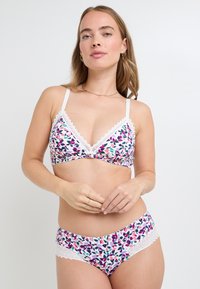 Bralette à imprimé floral et culotte taille haute assortie en blanc, rose et vert. Présente des bords en dentelle et des bretelles réglables. Tissu doux.