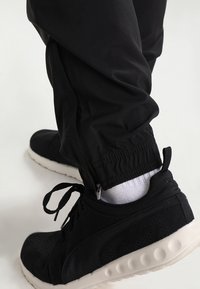 Puma Träningsbyxor - black