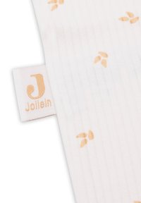 Couverture pour bébé en tissu blanc avec une texture côtelée, ornée de petits motifs de feuilles dorées et d'une étiquette portant la marque "Jollein".