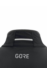 Black jacket with a high collar, featuring a reflective stripe at the back and 'GORE' logo in white below the collar.