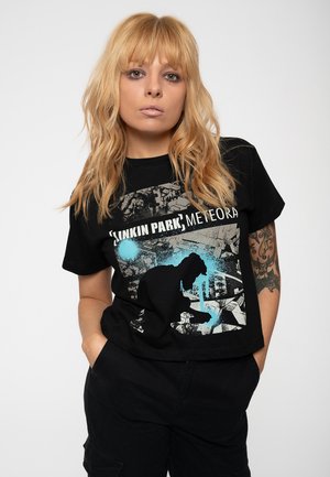 Black cotton t-shirt featuring a graphic design with blue accents, the text "Linkin Park Meteora," and an artistic silhouette.