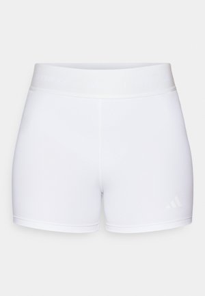White athletic shorts with a smooth texture, elastic waistband featuring embossed logo, and a minimalist design.