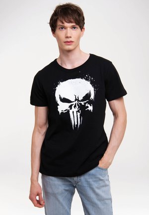 Sort bomulds T-shirt med et stort hvidt kranie grafik med splatterdesign. Rund hals og korte ærmer, afslappet pasform.