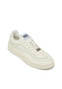 White sneakers featuring a smooth leather upper, perforated toe box, textured side accents, and a logo on the tongue. Thick rubber sole.