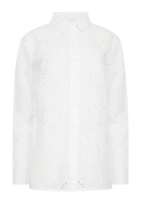 Camisa de algodón blanca con un diseño de botones, que presenta patrones recortados intrincados y un cuello clásico. Mangas largas y un ajuste relajado.