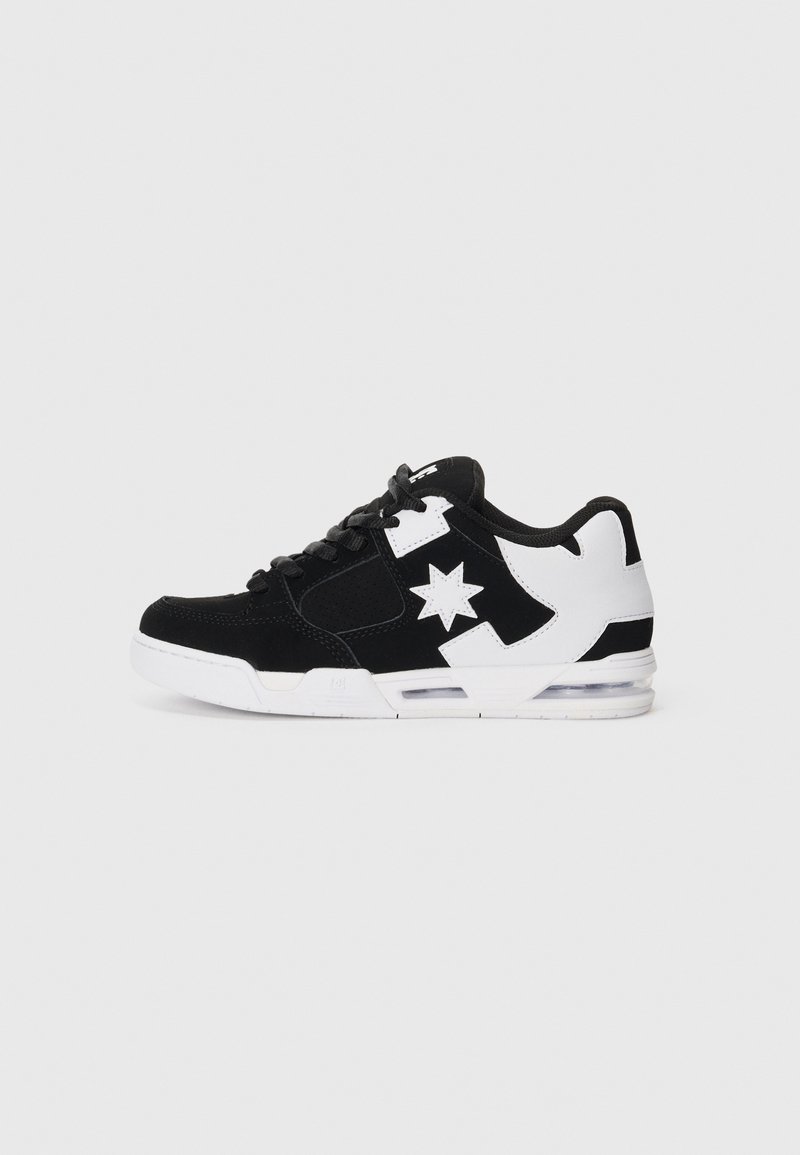 Black suede sneaker with white accents, featuring a star logo, rubber sole, and perforated detail. Low-top design with laces and air cushioning.