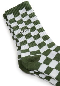 Calcetines a rayas verdes y blancos de material acanalado, con un logotipo de Vans bordado en negro en el lateral.