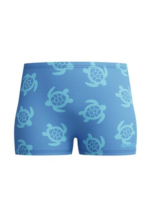 Bañador azul con un patrón de tortugas marinas azul claro y un pequeño logo blanco de Speedo en la parte inferior derecha.
